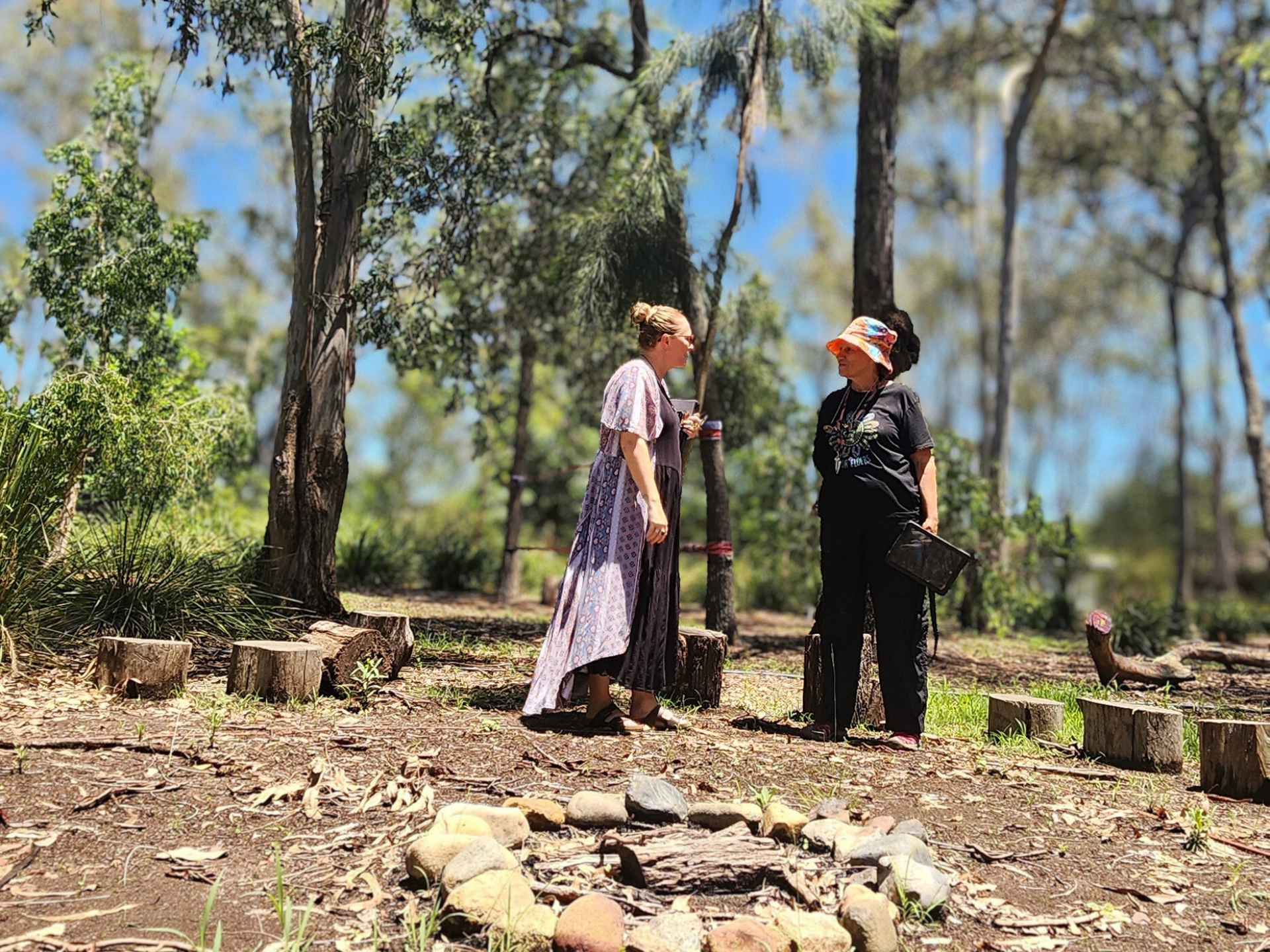 A Phoenix Support facilitator coaching an educator outdoors at their service