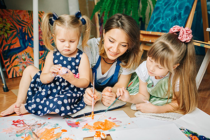 An educator engaged in play with children